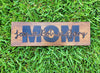 MOM Names Sign